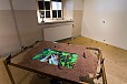 Lotte Nilsson-Välimaa, intallation with snails and video, ceramics, wax, table with screen and sound